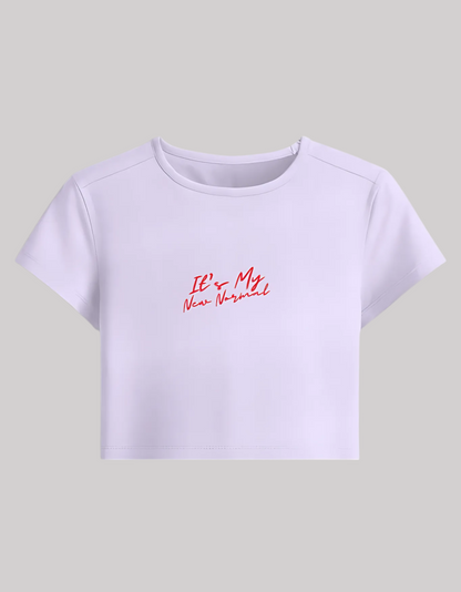 Women’s Baby Tee – “It’s My New Normal” Slogan | Stretchable Fit | 240 GSM Cotton-Spandex | Gen Z Style | Bio-Washed & Pre-Shrunk